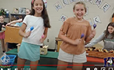  two girls dancing with instruments