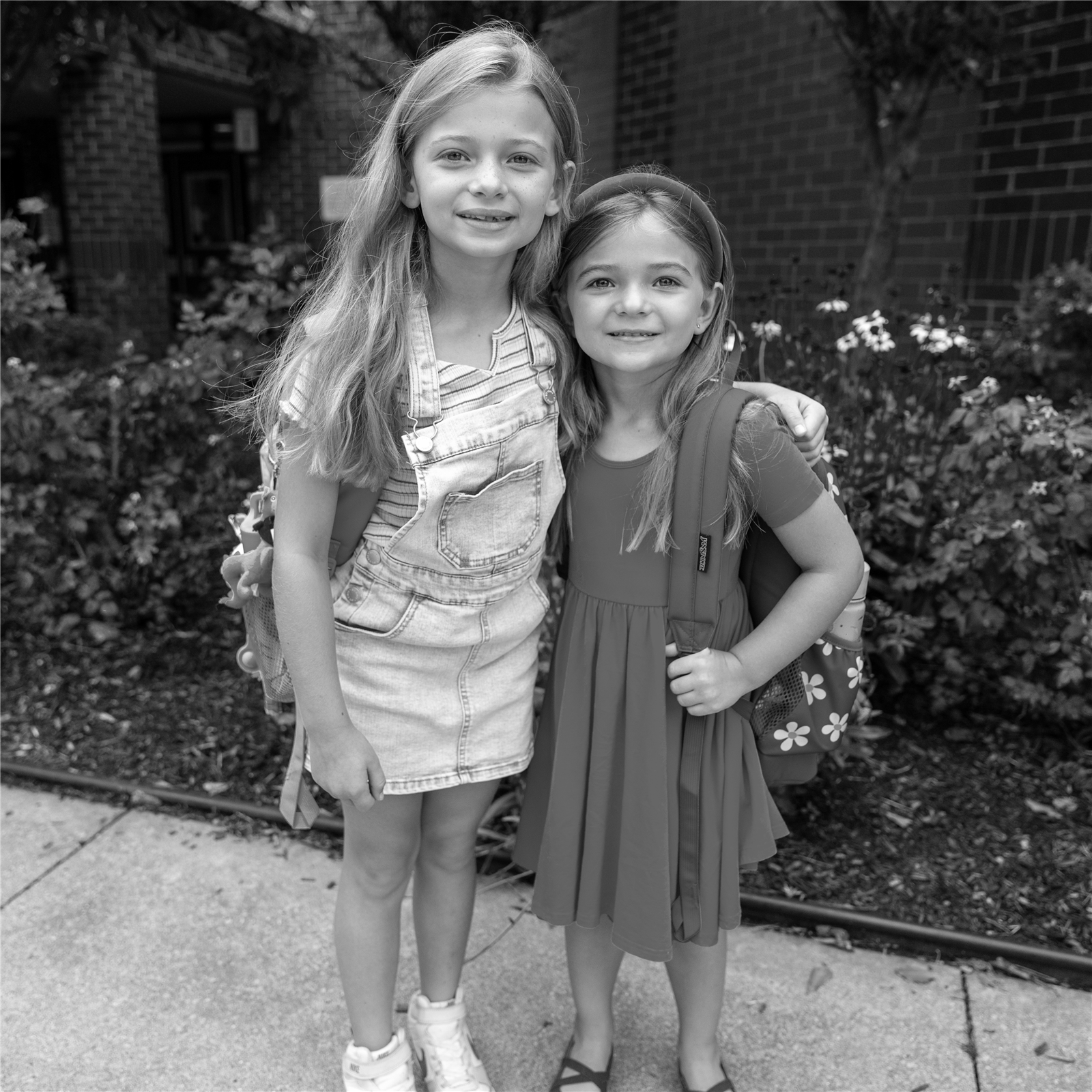 two girls smiling in front of BES