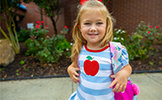  girl with apple on her shirt