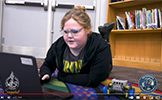 girl on computer in library