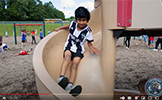  boy going down slide