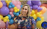  Principal Janet Alexandrow in front of colorful balloons