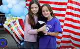  two girls with panther stuffed animal