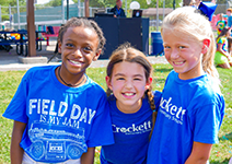 three girls in blue shirts