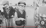  two boys dressed as 100 year old men in black and white photo