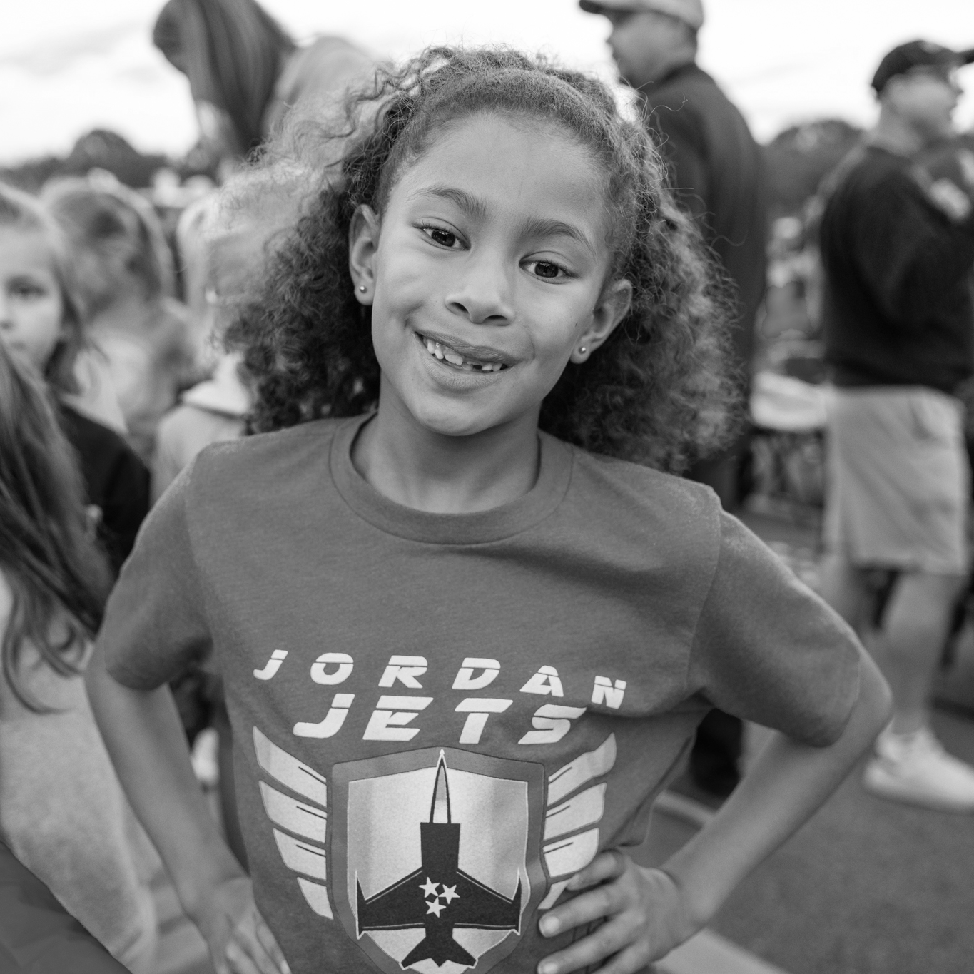 girl smiling in JES shirt
