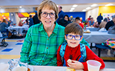  grandma and boy eating breakfast