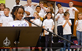  girl singing into a microphone