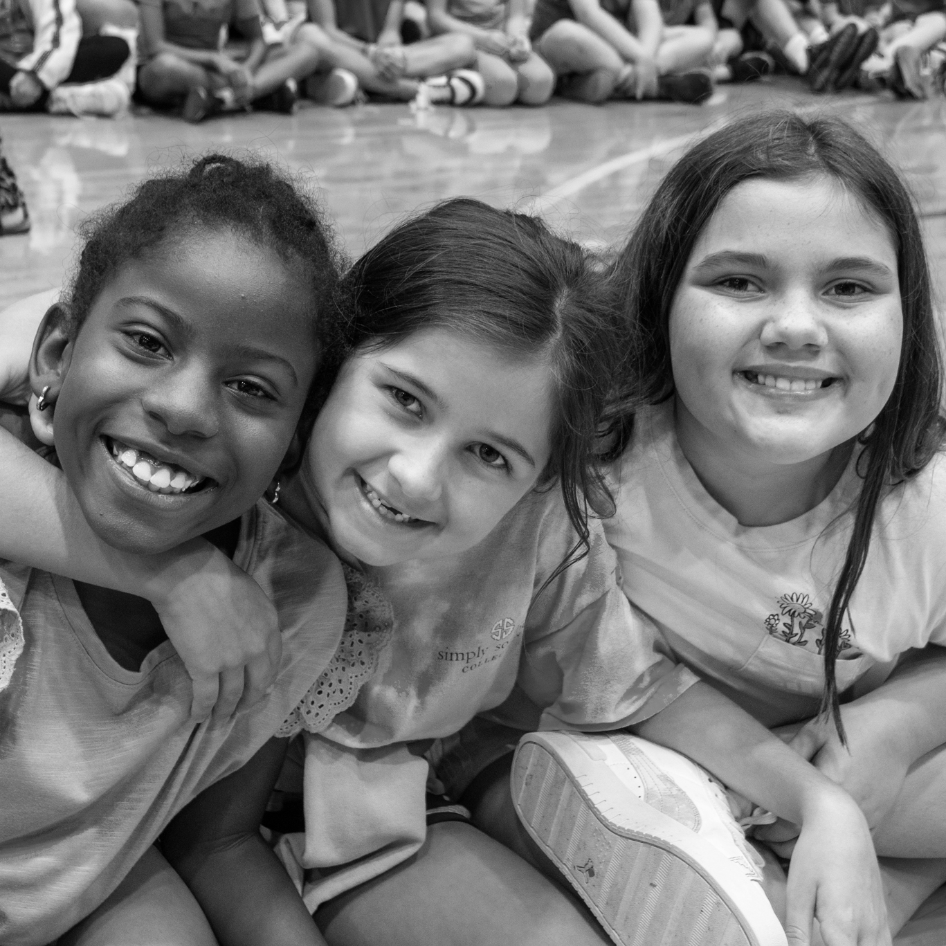 three girls smiling
