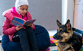  girl reading to dog