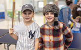  two boys dressed as Davy Crockett and Babe Ruth
