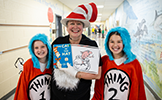  teacher and two students dressed as characters from the cat in the hat