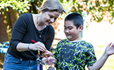  teacher and student with plant
