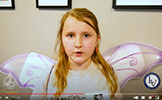 girl with fairy wings talking 