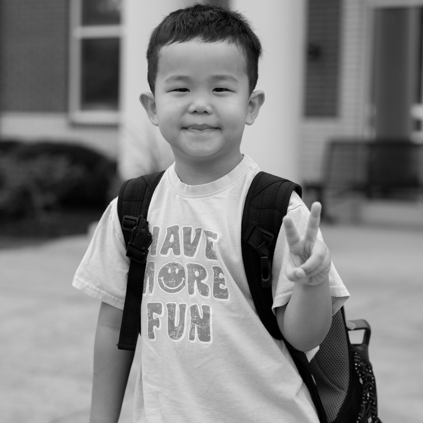 boy student giving the peace sign