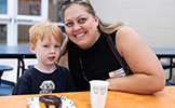  mom and son with a donut