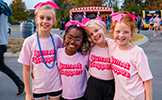  four girls in pink shirts