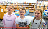  three girls in library