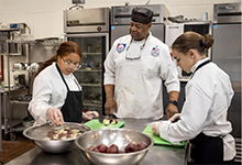  Culinary teacher Charles Gillespie with students in FHS kitchen