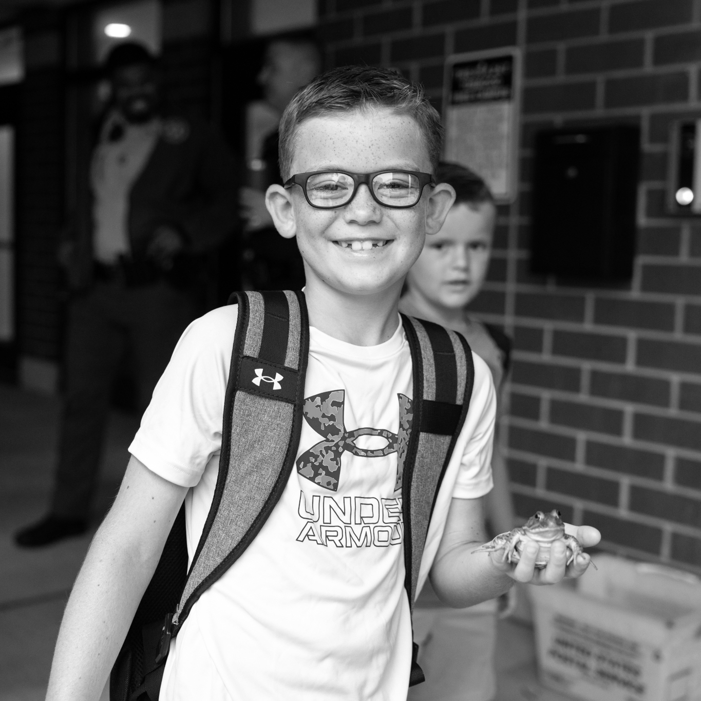 boy holding a frog