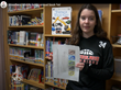  WMS student pictured standing in front of books