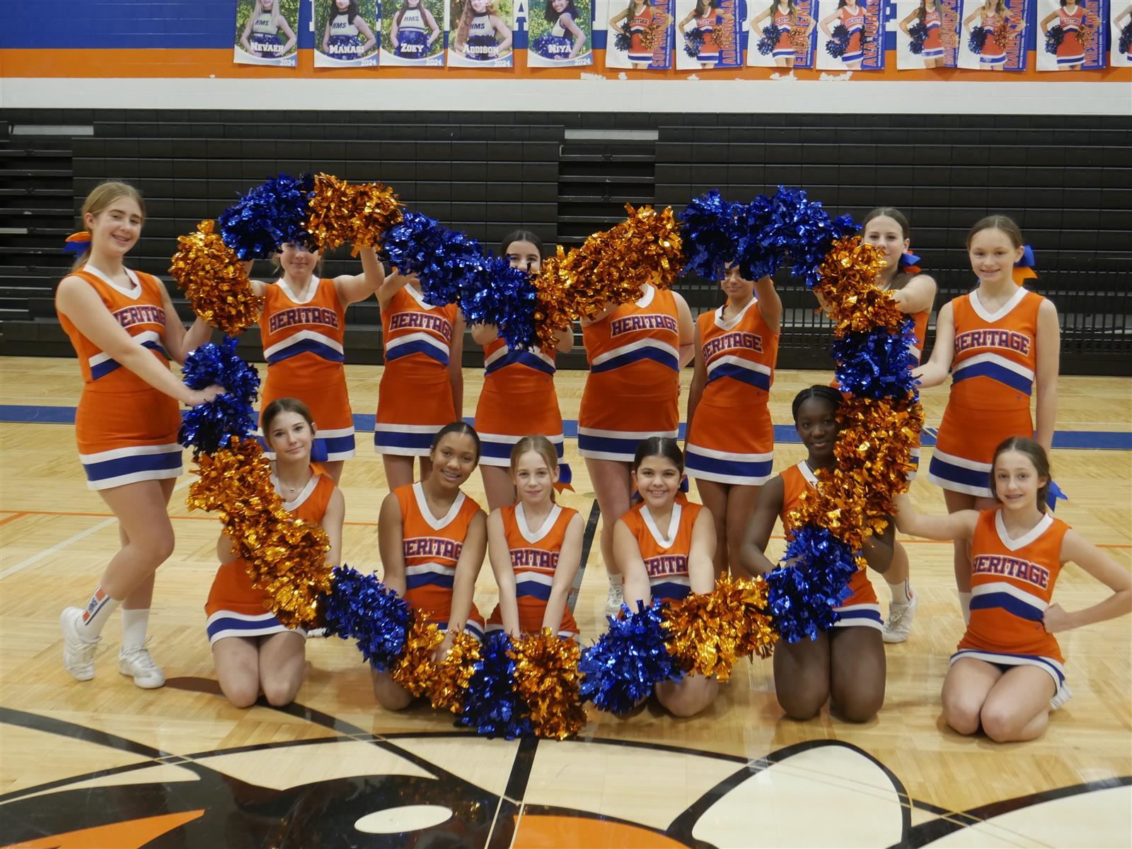  Cheerleaders form heart with pom poms