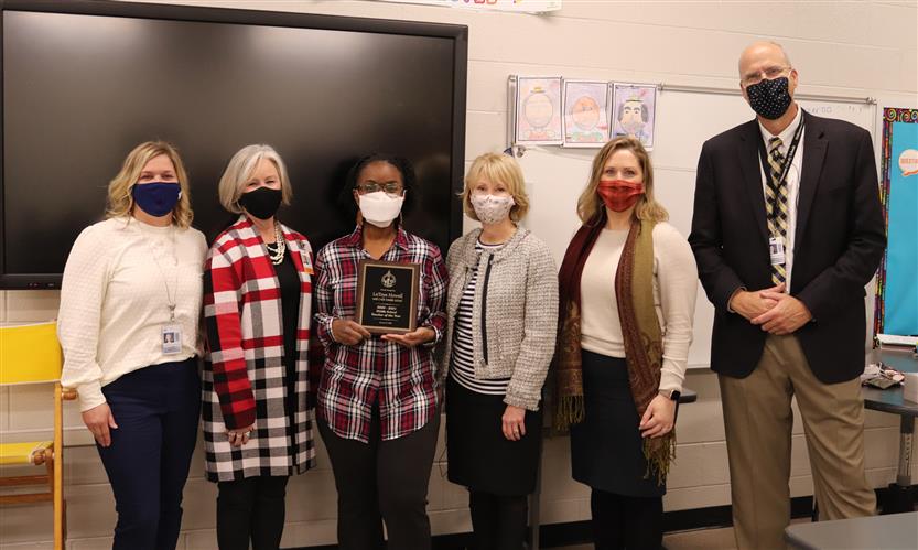 teacher and administrators take group photo