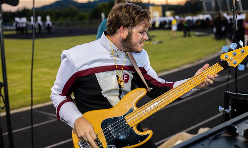 Bands perform on football field
