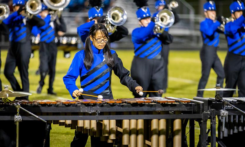 Bands perform on football field