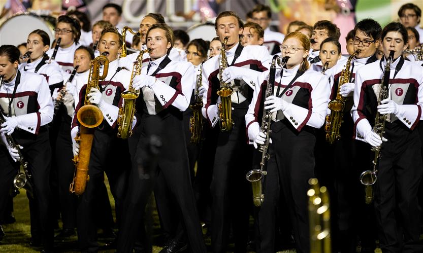 Bands perform on football field