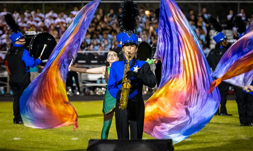 Bands perform on football field