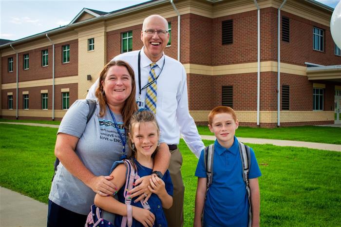 Super Golden with a family on the first day of school